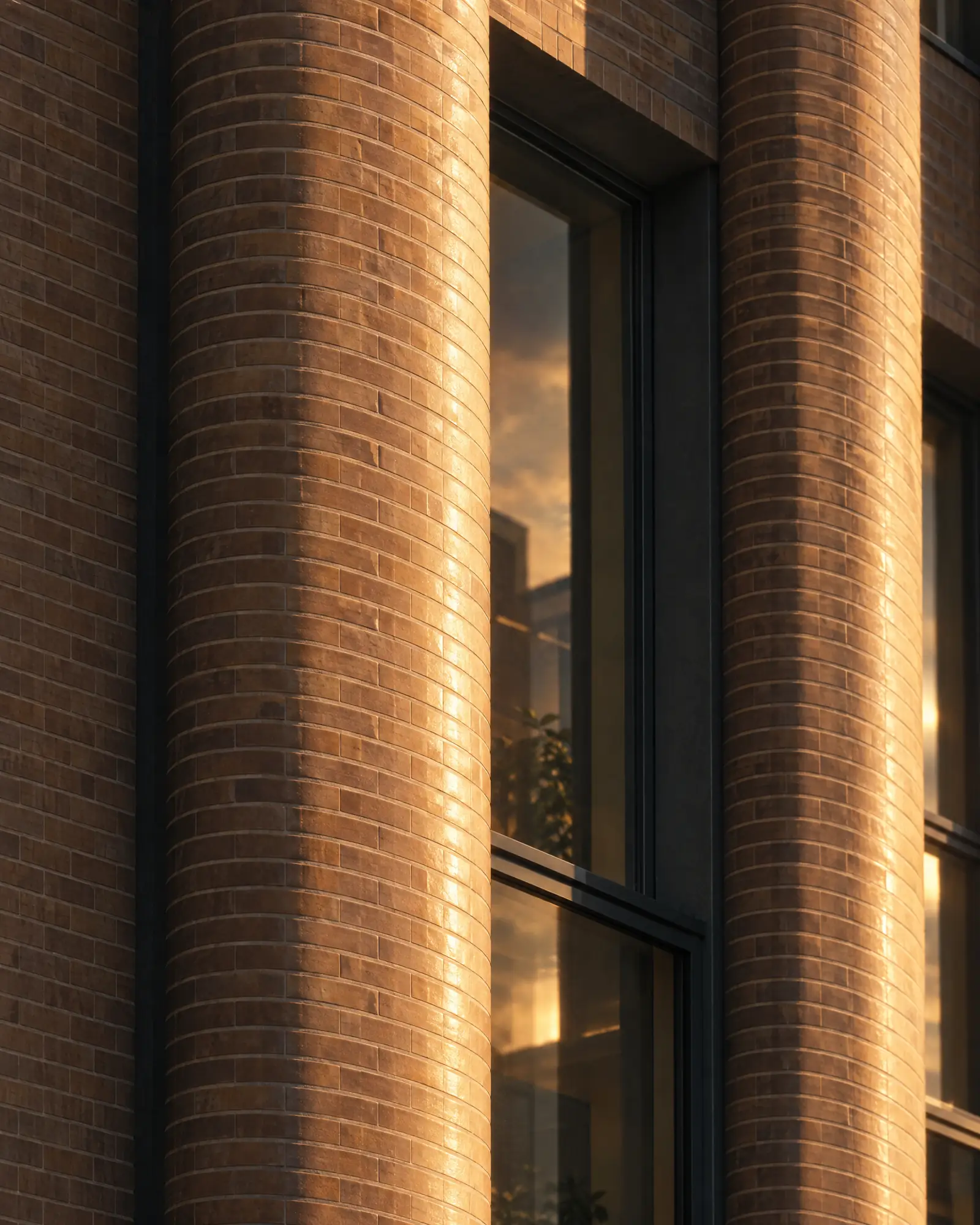Fluted brick piers and deep window reveals