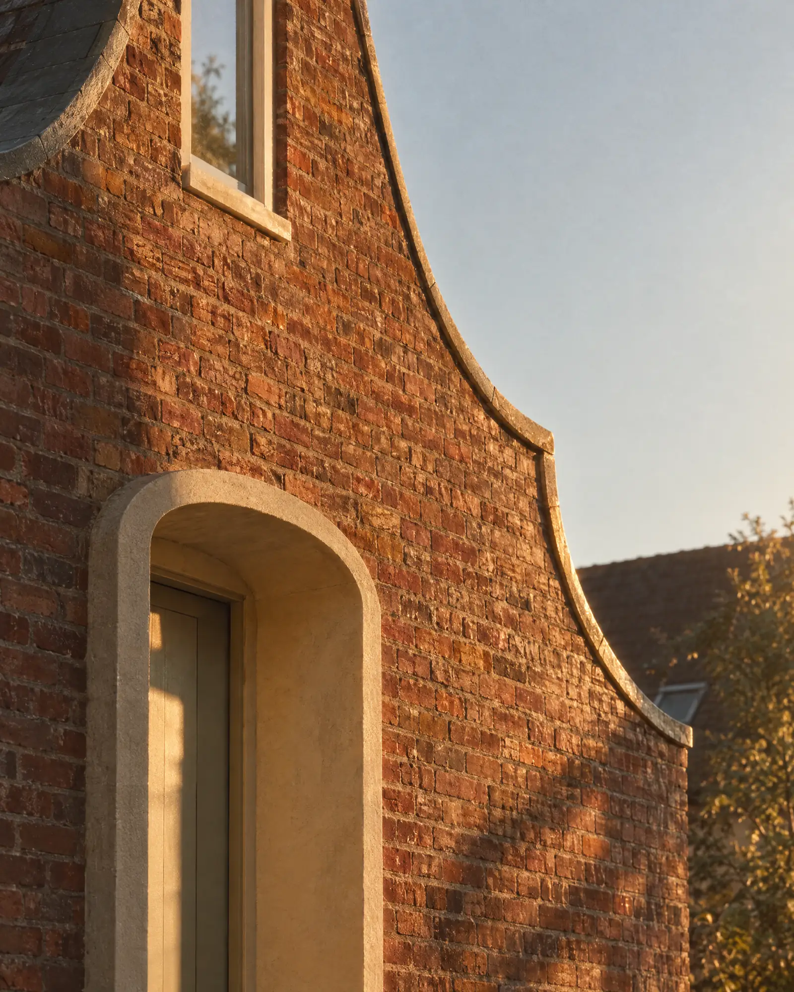 Hand-made brick and a deep arched door
